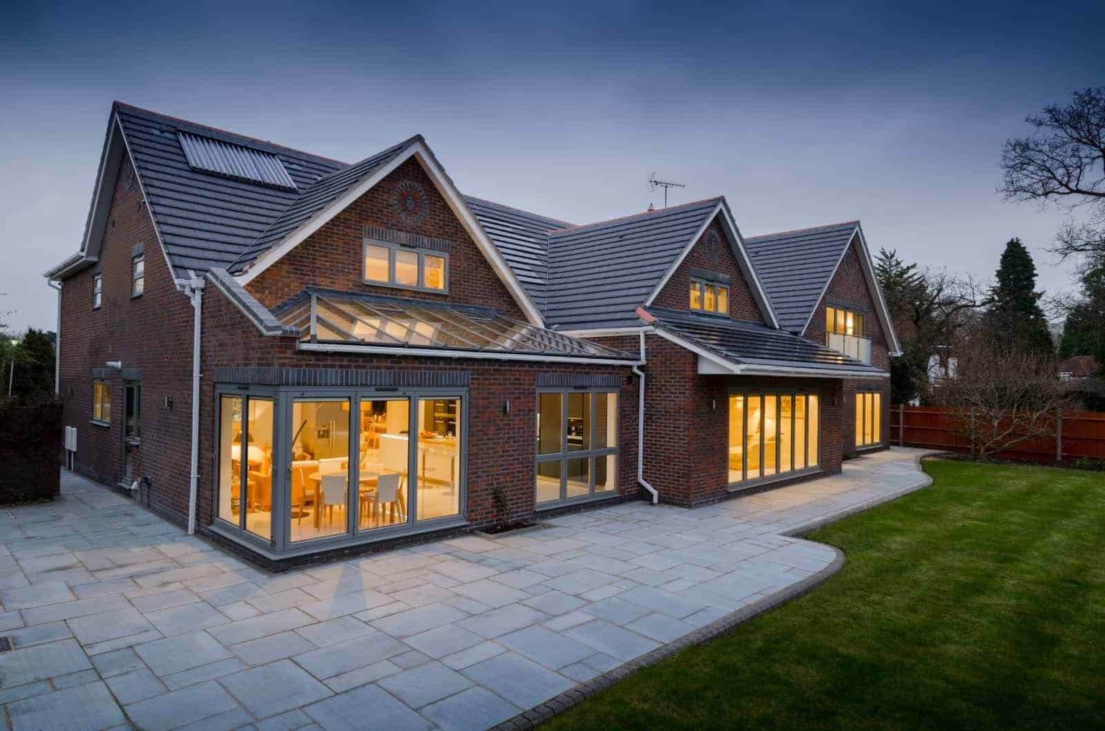 A modern house with glass doors and windows.